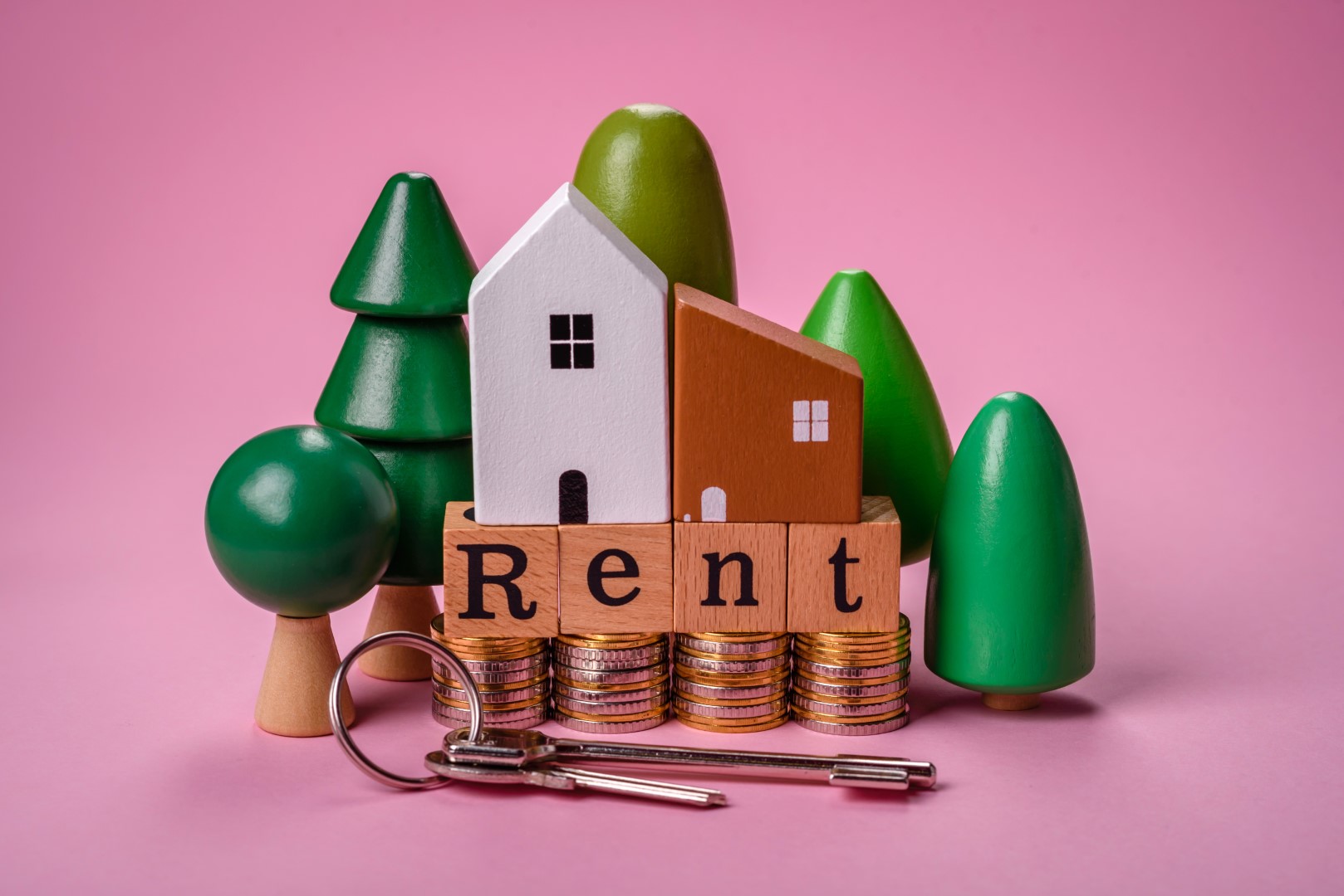 Small wooden house with 'For Rent' inscription representing property management by Residewell Homes